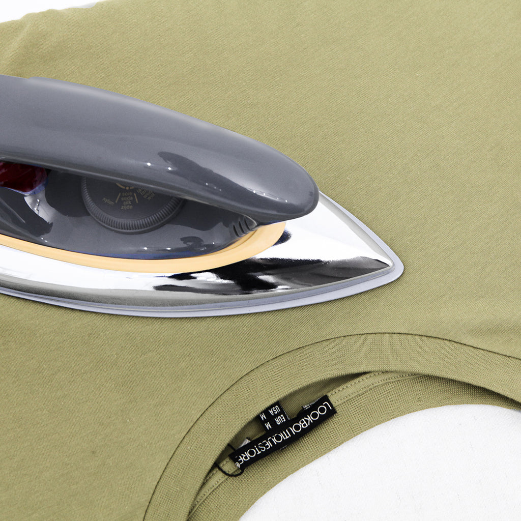 Ironing tencel fabric on a shirt with an iron.